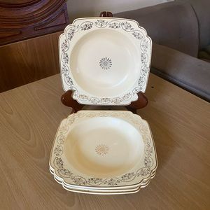 Cream and gold salad plates - homer Laughlin daisy print